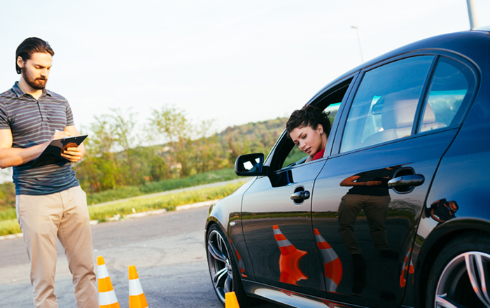 Driving,School,Or,Test.,Beautiful,Young,Woman,With,Instructor,Learning